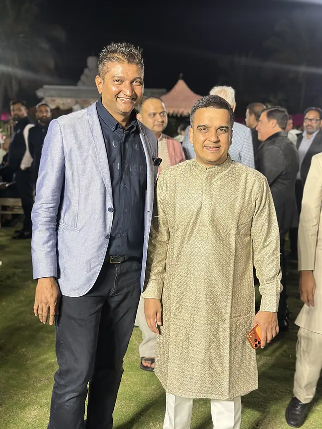 Kishore with a groom at a wedding night