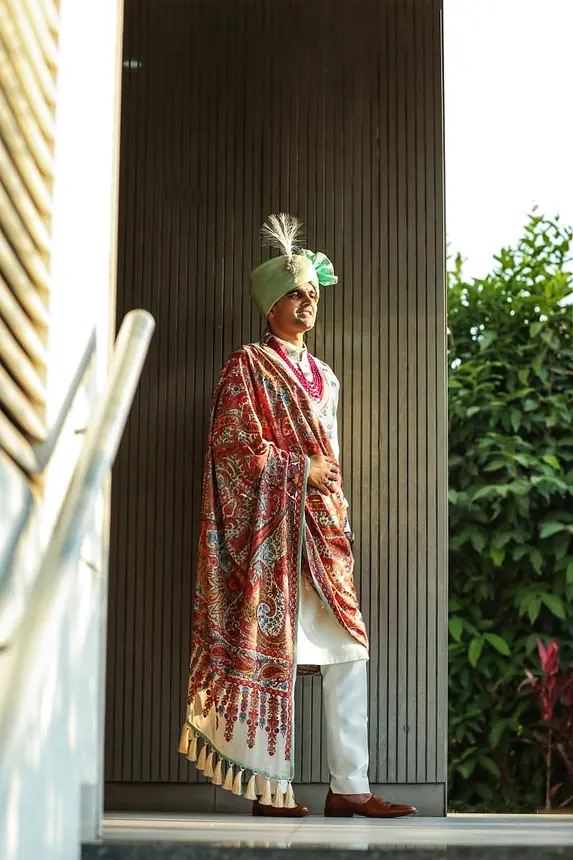 Groom in a red paisley shawl