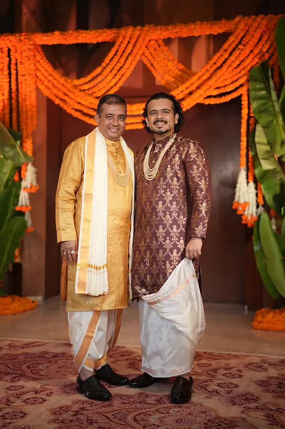Groom in South-style dhoti with draped dupatta