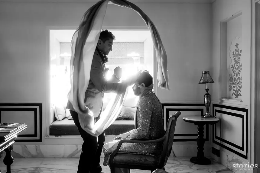 Kishore draping the groom's shawl before the wedding